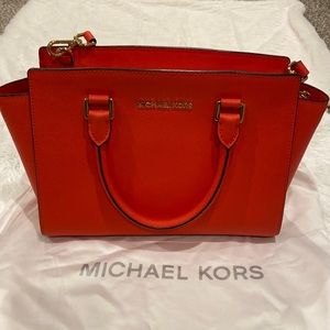 Red Michael Kors satchel handbag